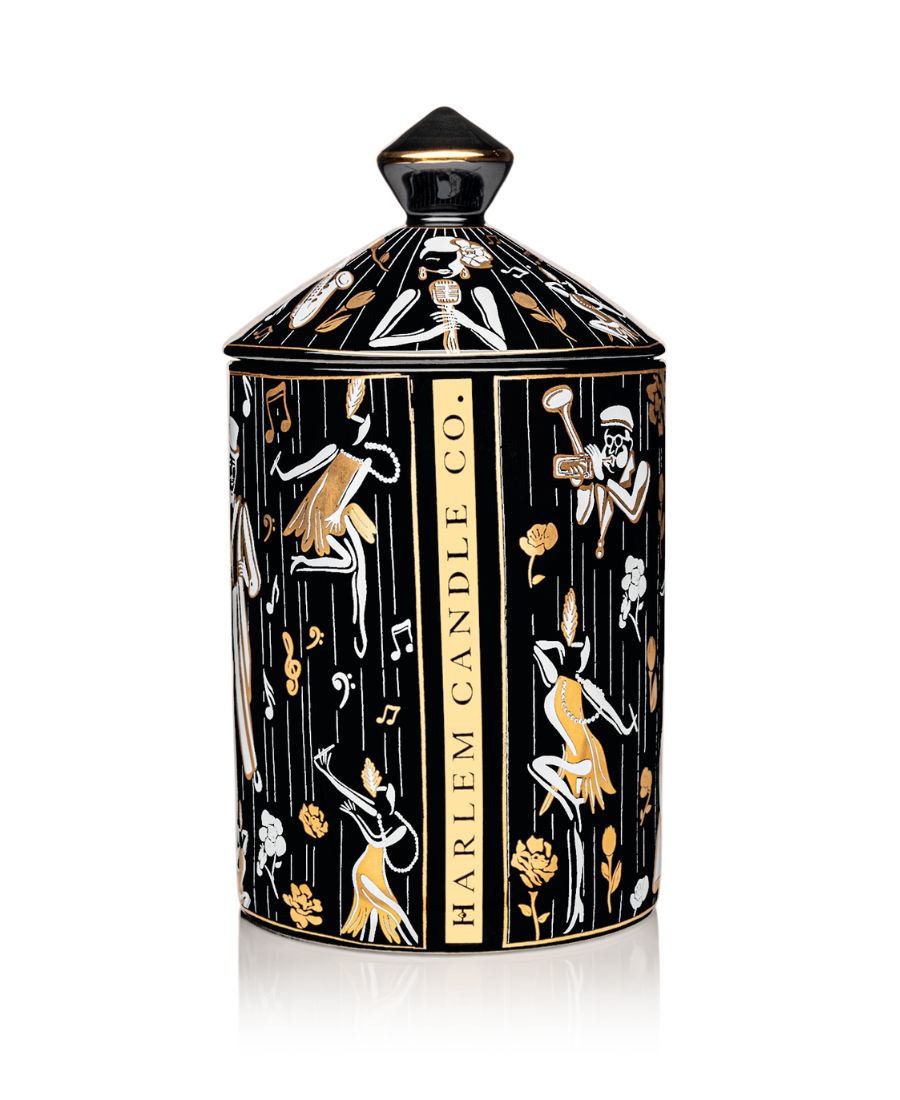 This is an image of our black gold and white Duke, ceramic candle with a lid. It features illustrations of Billie Holiday, the savoy ballroom, Duke Ellington, and other original illustrations. This is the back of the candle with the words Harlem Candle Co