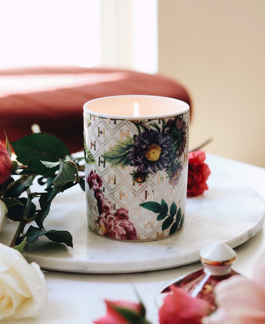 Lady Day Ceramic Candle on a marble tray with flowers and the lid.
