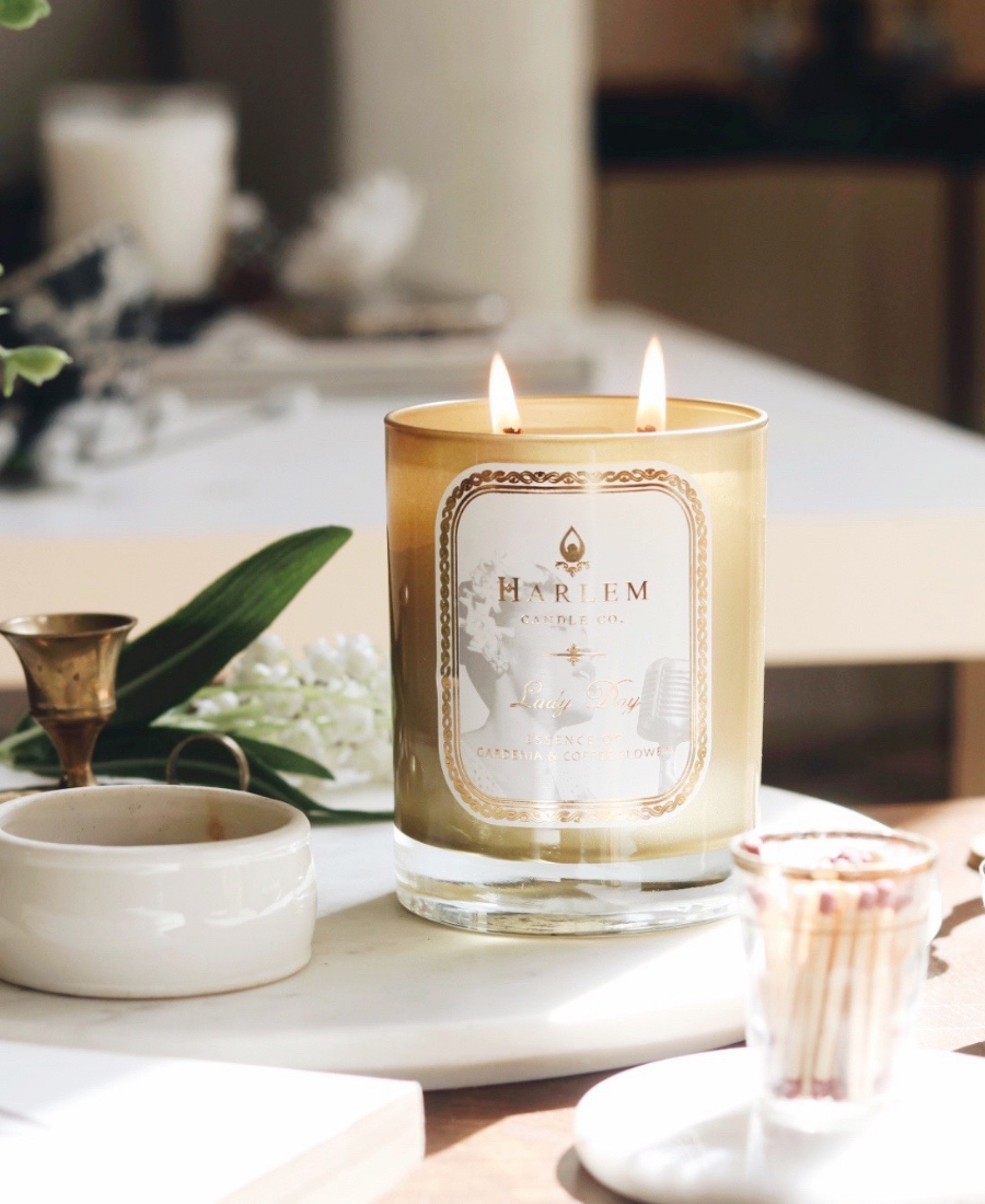 Lady Day Candle on a white tray with matches and flowers.