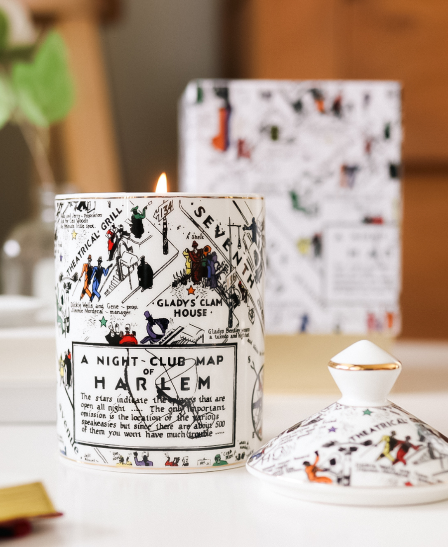 Langston Ceramic Candle on a white table with box and candle lid.