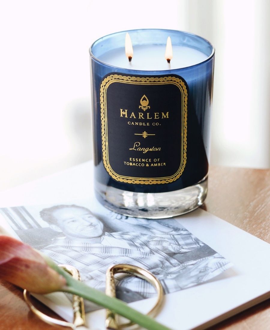 Langston Candle on a table with a black and white photograph.