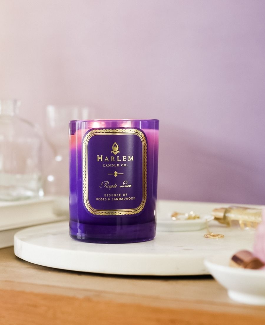 Purple Love Candle on a marble tray with a light purple background.