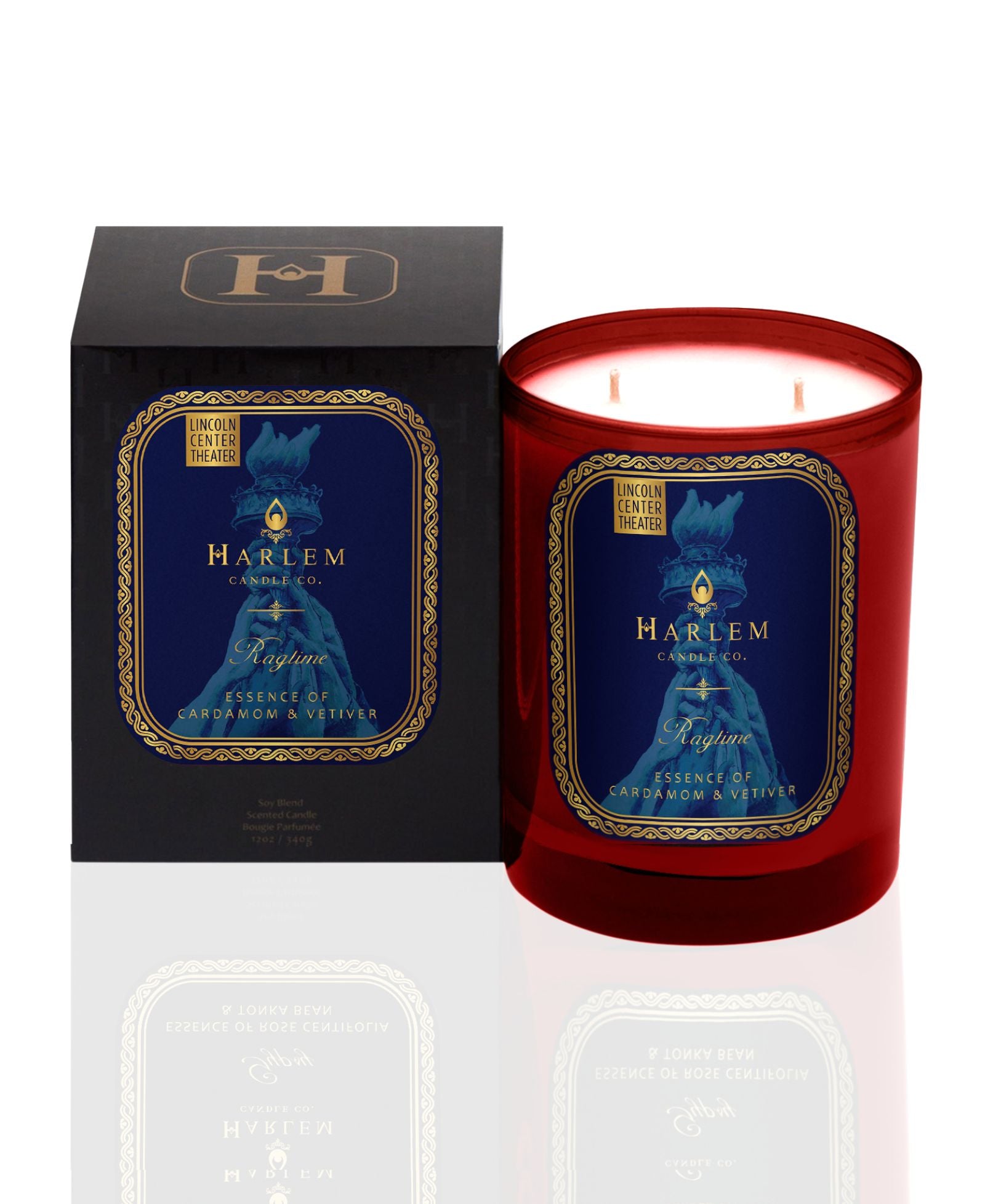 Harlem Candle Co. Ragtime candle with a blue label in a red glass on a white background