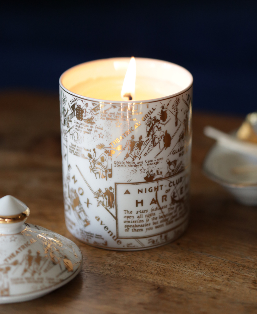 Speakeasy Ceramic Candle on a wooden table with the candle lid and a ceramic dish.