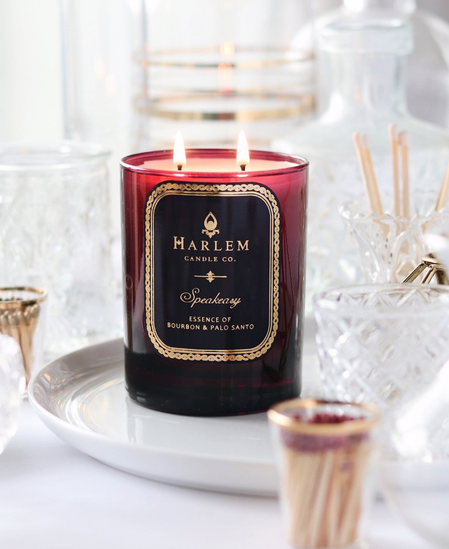 Speakeasy Candle on a white tray with glassware and matches.