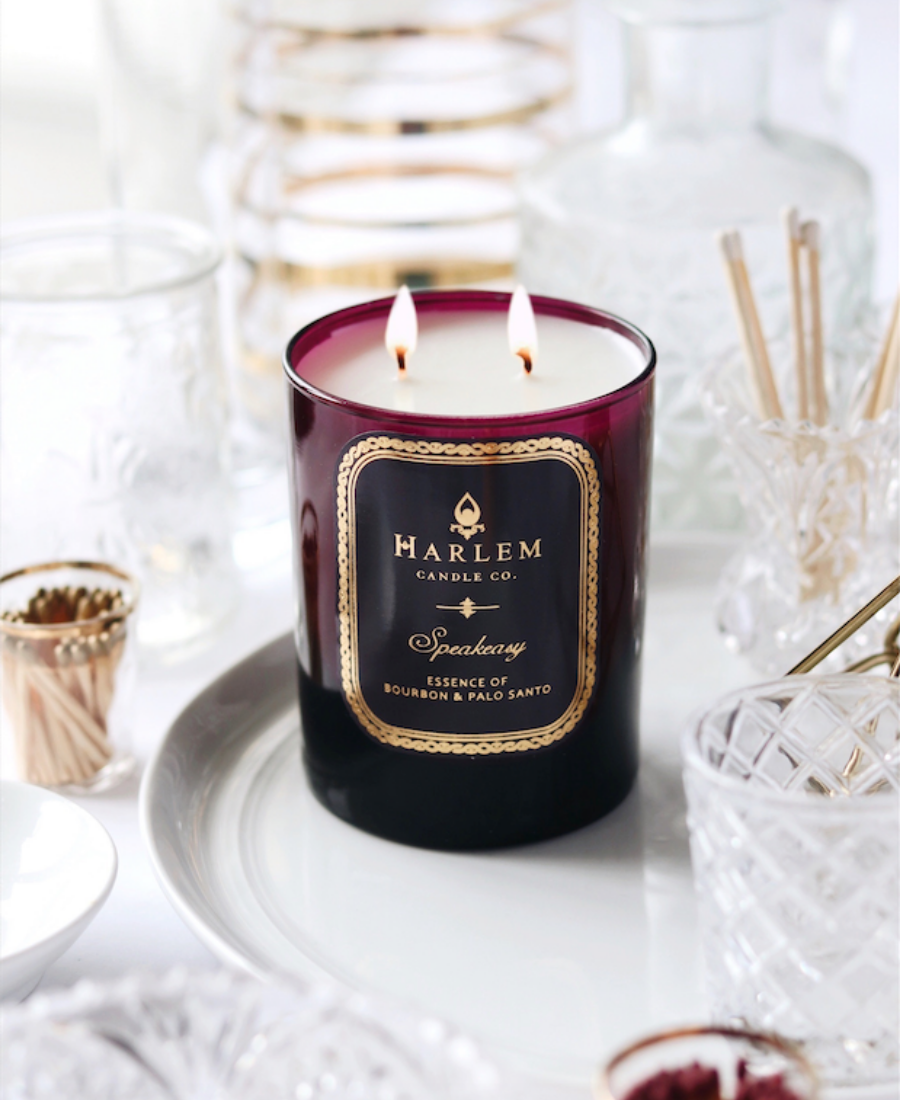 Speakeasy Candle on a white tray with glassware and matches.