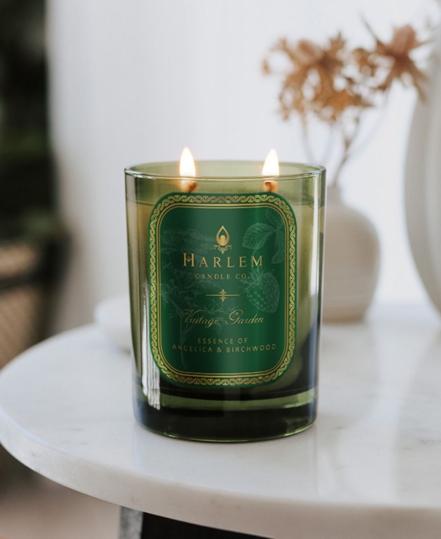 Vintage Garden Candle on a marble table with flowers.