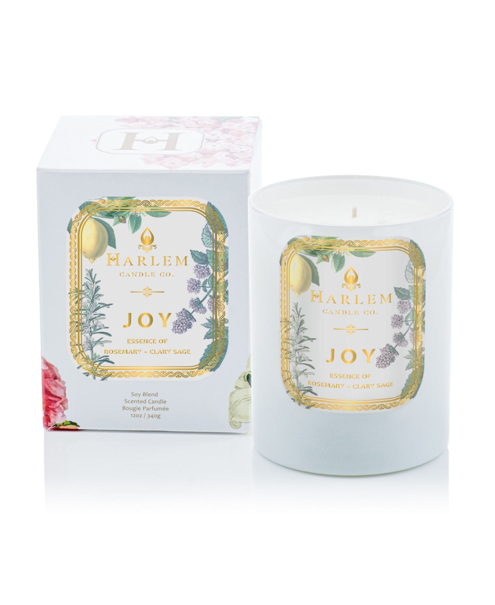 A photo of our Joy candle next to it's decorative box