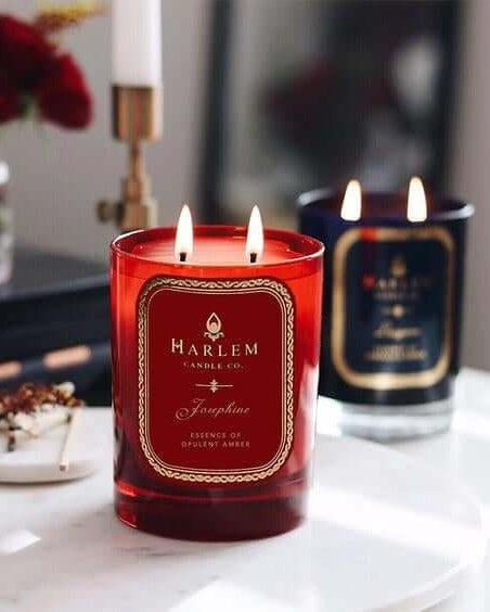 Lifestyle image of our Josephine Candle with other candles illuminated in the background