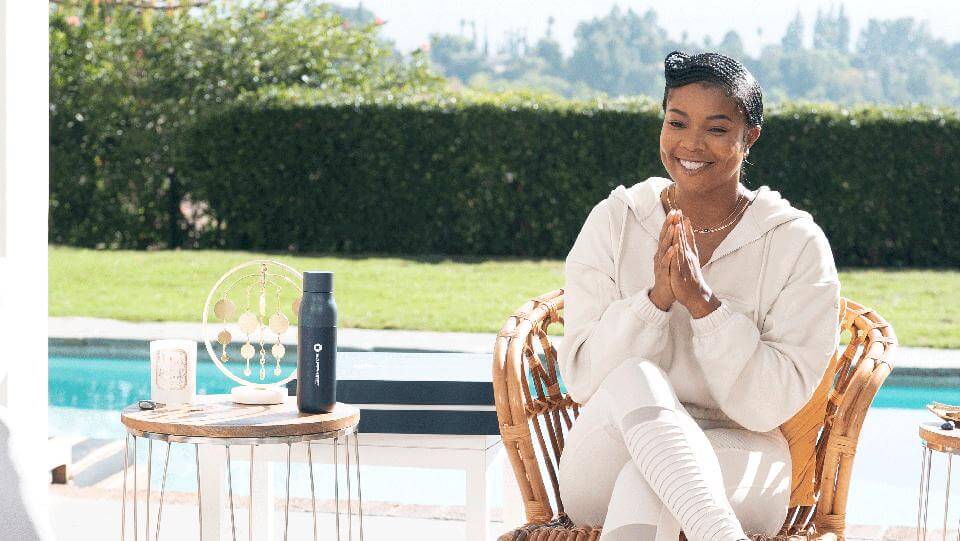 Gabrielle Union sitting in a chair