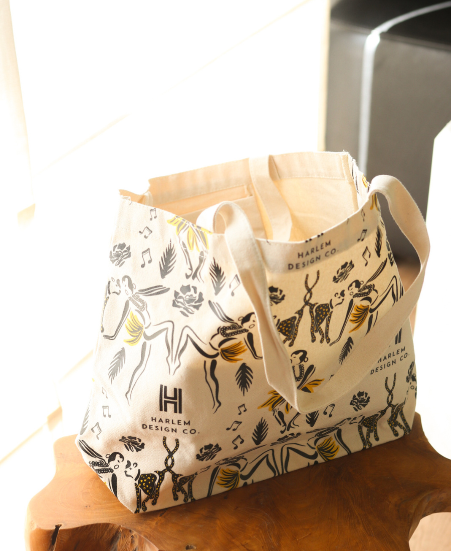 Josephine Baker inspired tote bag on a wooden surface.