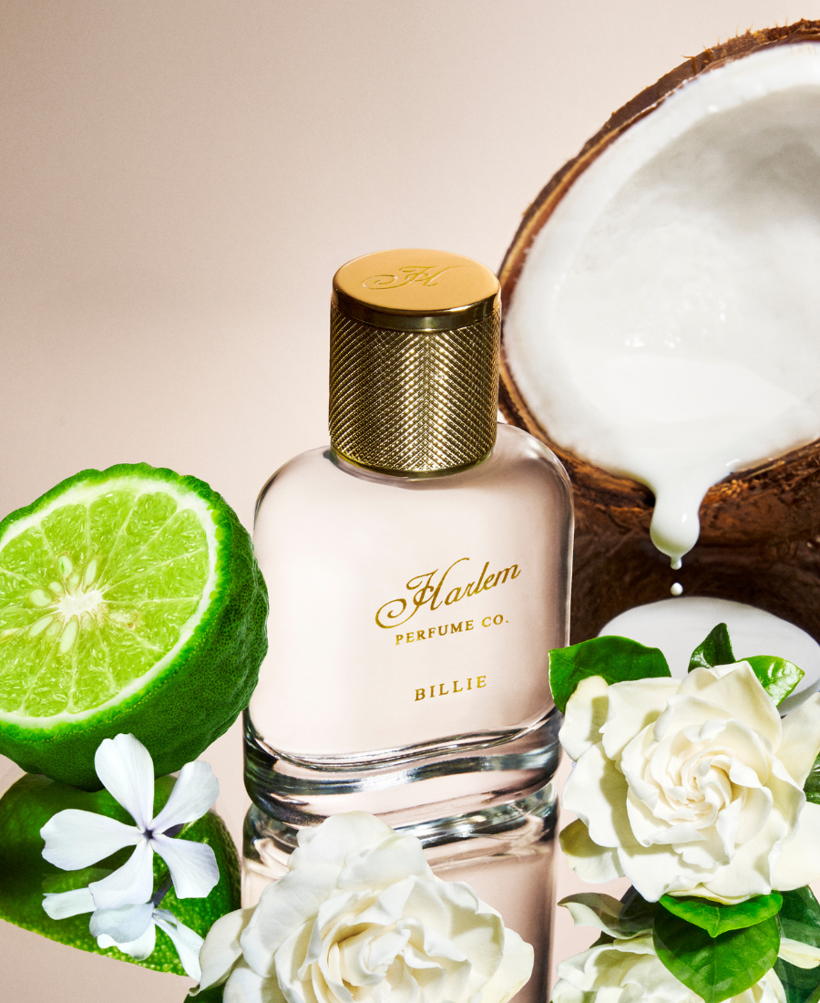 Perfume bottle labeled 'Harlem Perfume Co.' with coconut, lime, and flowers on a beige background