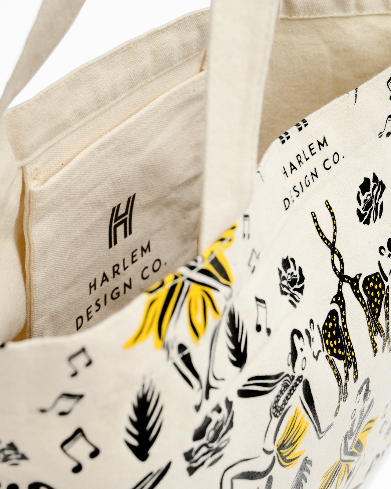 Inside view of canvas tote bag with Harlem Design illistrations of Josephine Baker and her cheetah. 