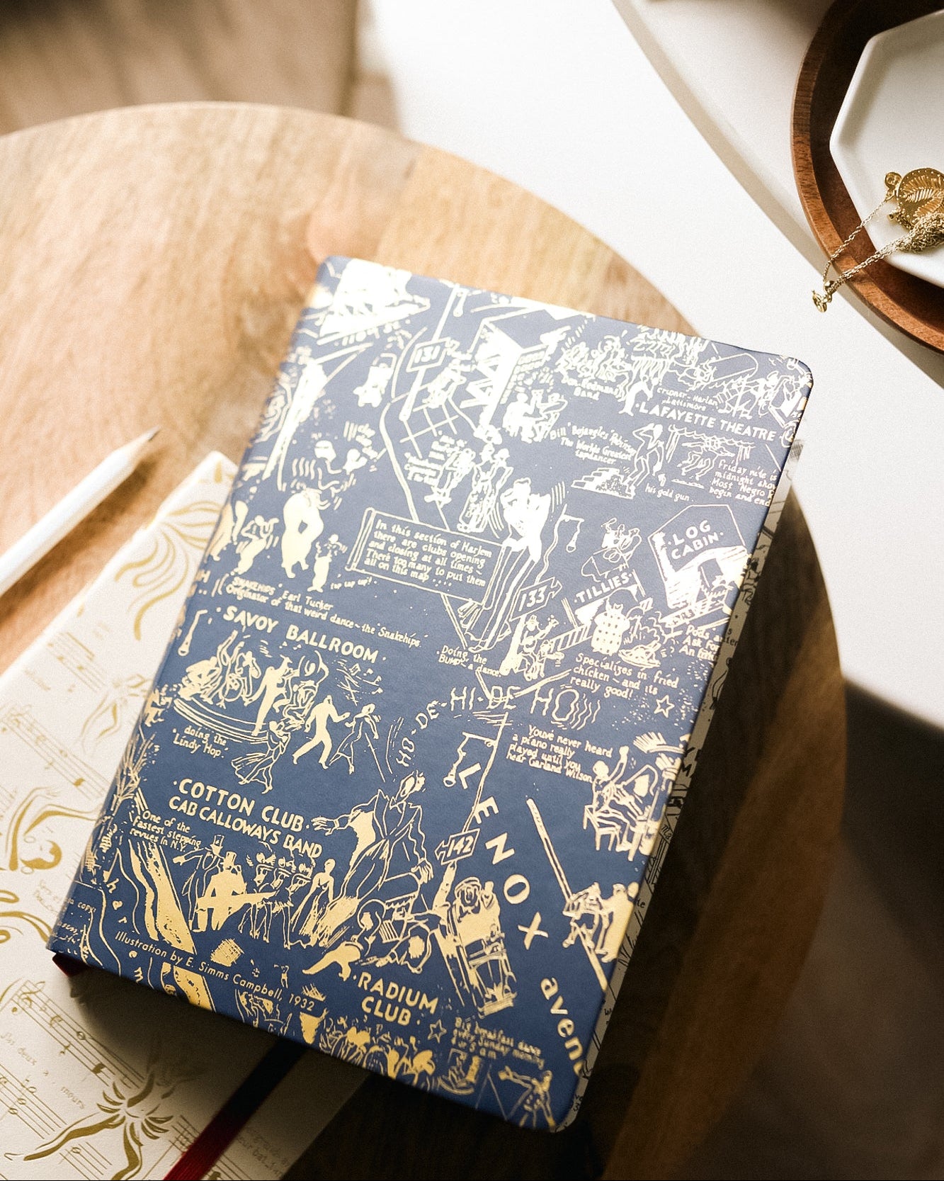 This is an image of our navy and gold night club map of Harlem journal by the Harlem design company