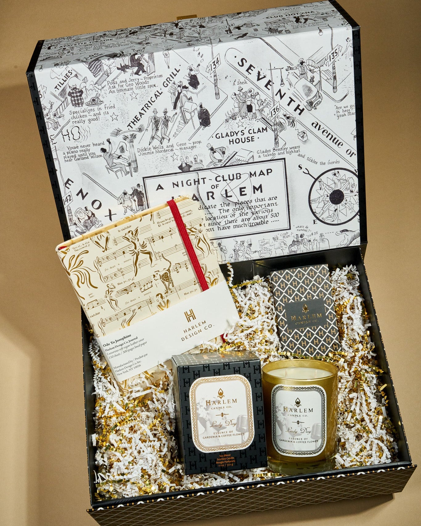 This is an image of our lady day, diary gift box which includes our 11 ounce lady day candle, cream, and gold Josephine Journal, and our black and white art deco inspired matches.This is an image of our lady day, diary gift box which includes our 11 ounce lady day candle, cream, and gold Josephine Journal, and our black and white art deco inspired matches.