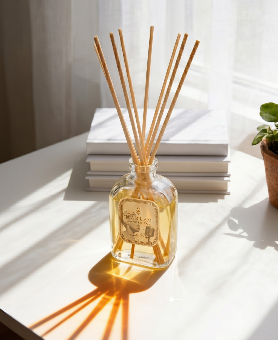 Image of our Lady Day reed diffuser in a lifestyle setting near a window with light reflecting inward.