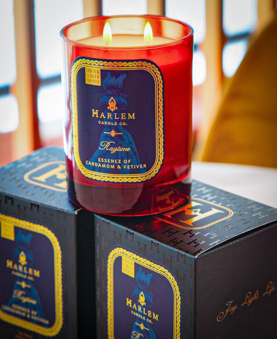 Harlem Candle Co. candle with a blue label on a box