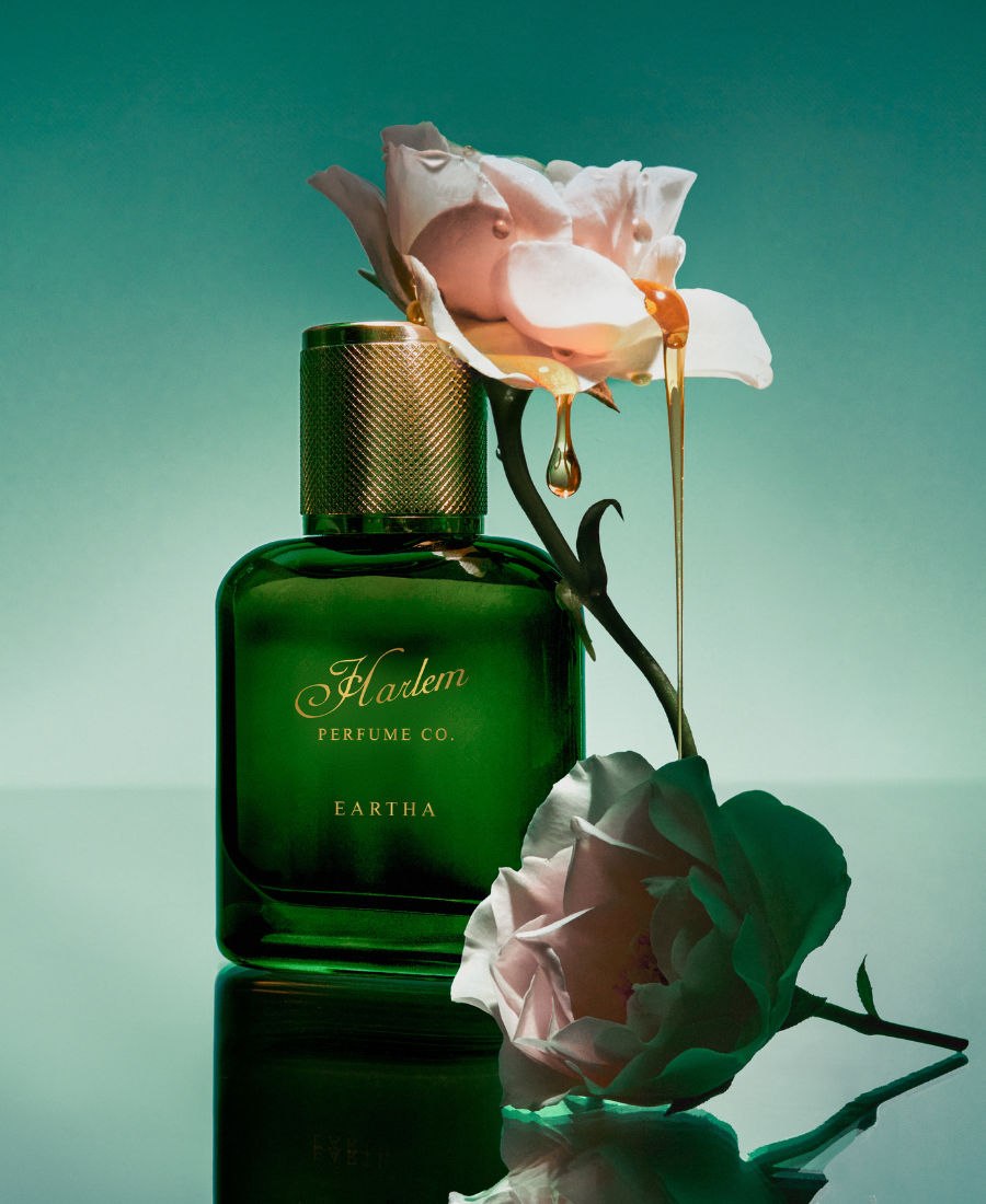 This is a lifestyle image of the Eartha eau de parfum with smoked rose