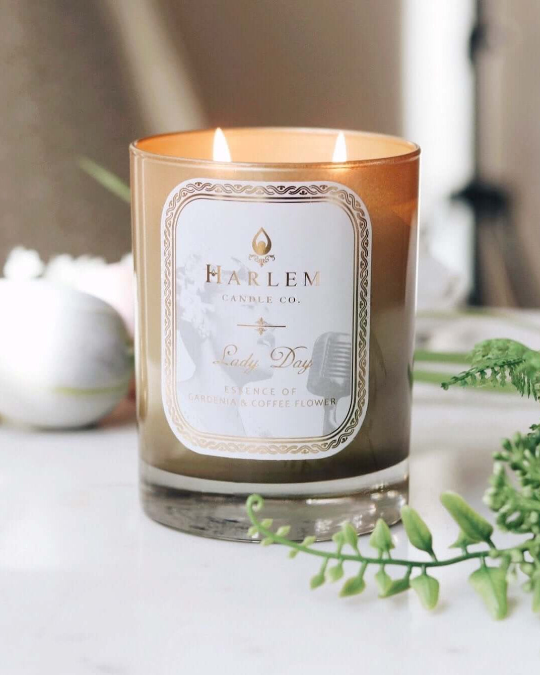 This is a lifestyle image of the lady day candle with flames illuminated.